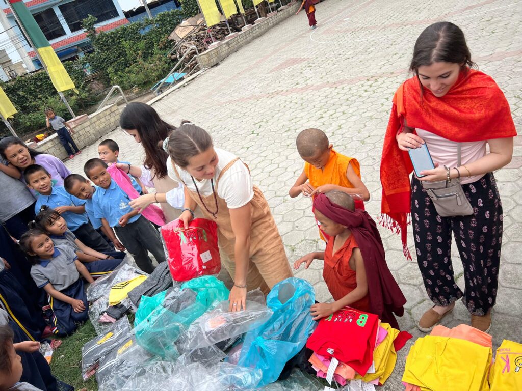 Chiara and Francisca, volunteers from Italy have donated new clothes to the Buddhist monks