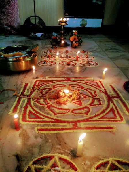 Volunteers Celebrate Dashain And Tihar Festivals In Nepal 5 Candles and petals decorated on the floor to celebrate