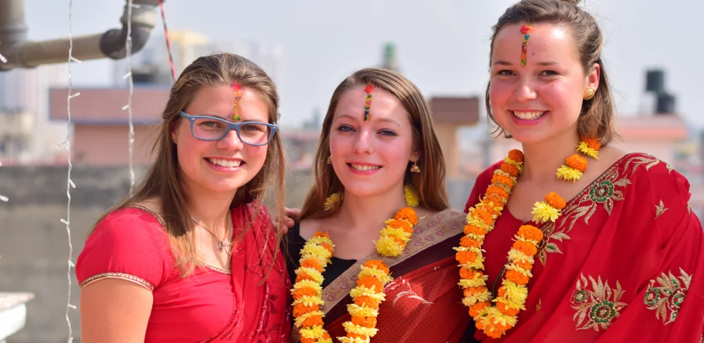 volunteer in nepal wearing nepali traditional dress