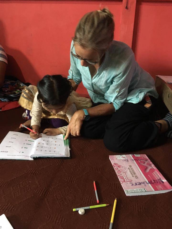 a Volunteer helping a student with homework 