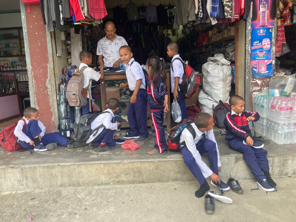 buying shoes for monks in nepal