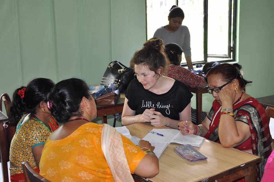 A volunteer teaching at the women centre 
